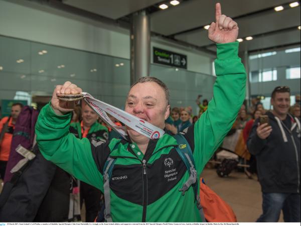 Cyril Walker returning home with his medal at Dublin Airport