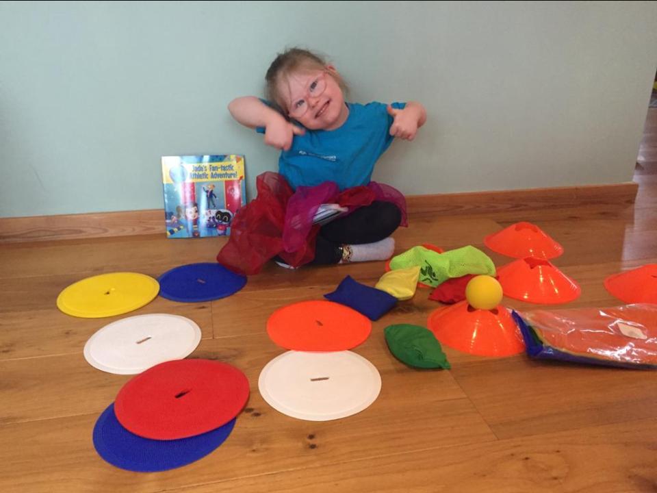 Young athlete with activity props